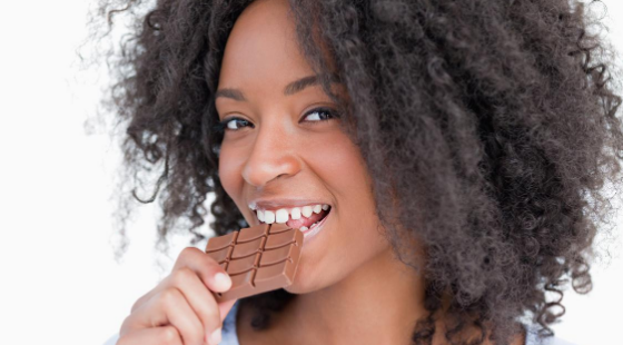 Woman Eating Chocolate